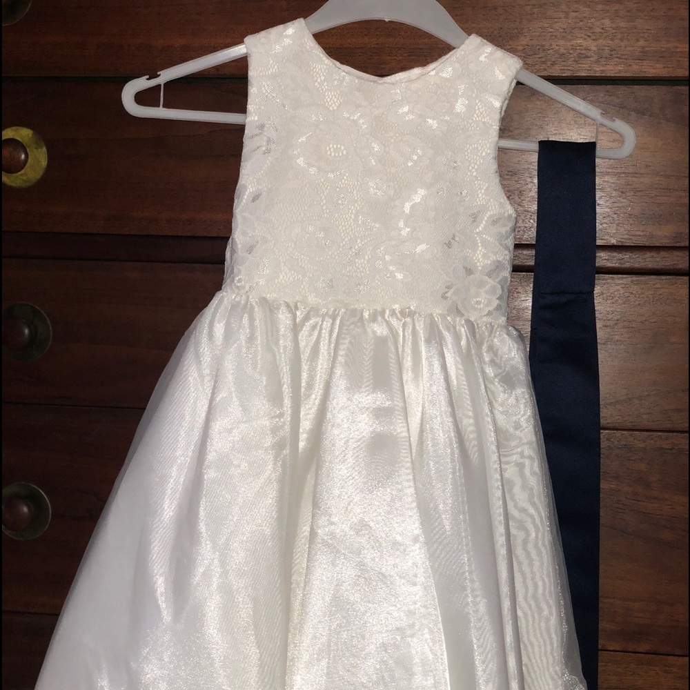 Ivory flower girl dress with navy sash